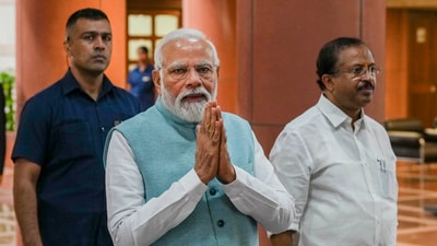 Prime Minister Narendra Modi with Union MoS for Parliamentary Affairs V. Muraleedharan arrives for the BJP Parliamentary party meeting, in New Delhi, Tuesday. (PTI) Prime Minister Narendra Modi with Union MoS for Parliamentary Affairs V. Muraleedharan arrives for the BJP Parliamentary party meeting, in New Delhi, Tuesday. (PTI)