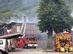  Firefighters work to extinguish a fire which erupted at a home for disabled people in Wintzenheim near Colmar, eastern France. 