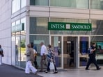 An Intesa Sanpaolo SpA bank branch in Brescia, Italy, on Tuesday. Italian stocks tumbled after a surprise new tax on bank profits sent the country's lenders tumbling, erasing as much as $10.4 billion from their combined market capitalization. An Intesa Sanpaolo SpA bank branch in Brescia, Italy, on Tuesday. Italian stocks tumbled after a surprise new tax on bank profits sent the country's lenders tumbling, erasing as much as $10.4 billion from their combined market capitalization.