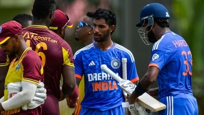 Tilak Varma (2R) and Hardik Pandya (R), of India, after winning the third T20I cricket match against West Indies (AFP) Tilak Varma (2R) and Hardik Pandya (R), of India, after winning the third T20I cricket match against West Indies (AFP)