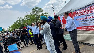 Ex-international students from India protested at a site in the Greater Toronto Area in June where they were joined by politicians like Conservative Party leader Pierre Poilievre (seen with hand raised). (Supplied photo)