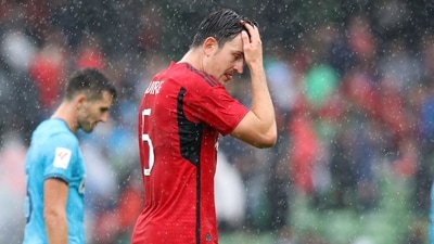 Manchester United's English defender Harry Maguire reacts as he leaves at half time during the pre-season friendly football match (AFP)