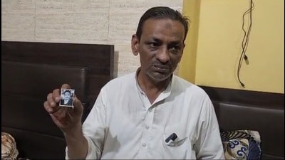 Faheem Hussain showing a photo of his father, who was killed in the 1980 riots in Moradabad. (HT) Faheem Hussain showing a photo of his father, who was killed in the 1980 riots in Moradabad. (HT)