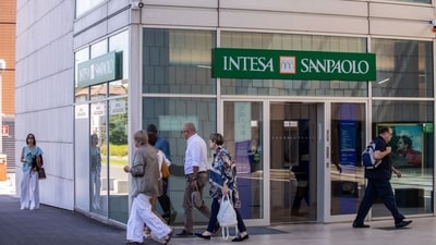 An Intesa Sanpaolo SpA bank branch in Brescia, Italy, on Tuesday. Italian stocks tumbled after a surprise new tax on bank profits sent the country's lenders tumbling, erasing as much as $10.4 billion from their combined market capitalization. (Bloomberg) An Intesa Sanpaolo SpA bank branch in Brescia, Italy, on Tuesday. Italian stocks tumbled after a surprise new tax on bank profits sent the country's lenders tumbling, erasing as much as $10.4 billion from their combined market capitalization. (Bloomberg)