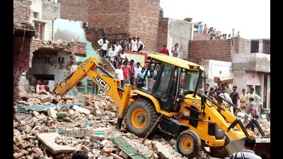 On Wednesday morning, bulldozers converged near Sri Krishna Janmbhoomi in Mathura. (HT Photo) On Wednesday morning, bulldozers converged near Sri Krishna Janmbhoomi in Mathura. (HT Photo)