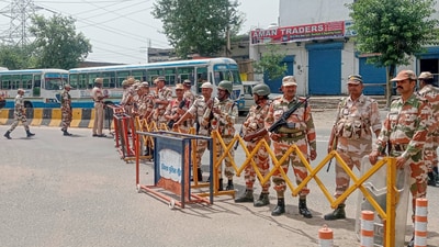 Security personnel stand guard after Haryana Roadways resumed services from the violence-hit Nuh district, (PTI)
