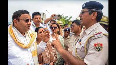 Police stop Aam Aadmi Party (AAP) Haryana state president and MP Sushil Kumar Gupta and other party leaders at the Gurugram-Nuh border near KMP Expressway flyover, in Nuh district on Wednesday. (PTI)