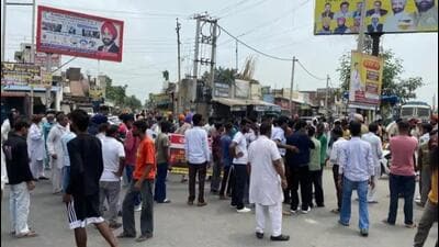 Protestors blocking the road in Kot Isse Khan chowk in Moga district after the firing incident. (HT Photo)