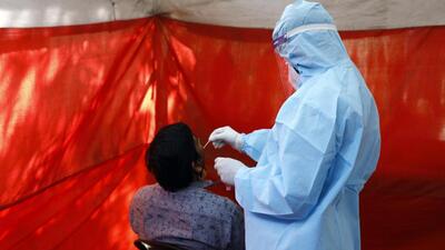 Pune, India - March 01, 2022: A health worker collects swab samples of a citizen for Covid-19 test at a centre in Katraj, in Pune, India, on Tuesday, March 01, 2022. (Photo by Rahul Raut/HT PHOTO) (Rahul Raut/HT Photo)