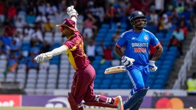 West Indies' Nicholas Pooran celebrates the dismissal of India's Sanju Samson (AP) West Indies' Nicholas Pooran celebrates the dismissal of India's Sanju Samson (AP)