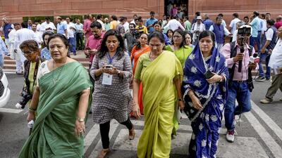 Union minister Shobha Karandlaje (centre in green) with other BJP women MPs outside Parliament on Wednesday. (PTI)