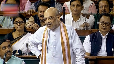 Union Home Minister Amit Shah speaks during discussion on the Motion of No-Confidence in the Lok Sabha during the Monsoon session of Parliament, in New Delhi, Wednesday, (PTI) Union Home Minister Amit Shah speaks during discussion on the Motion of No-Confidence in the Lok Sabha during the Monsoon session of Parliament, in New Delhi, Wednesday, (PTI)
