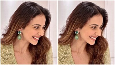Rakul Preet looked ravishing in a golden embellished ethnic top with a plunging neckline, full sleeves and a golden belt pattern at the waist. She further teamed it with a pair of matching sharara set with flowy wide legs.&nbsp; (Instagram/@rakulpreet)