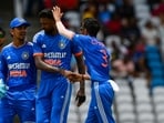 Ishan Kishan (L), Hardik Pandya (2L) and Yuzvendra Chahal (3L) of India celebrate