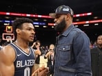 (Bronny James, #0, is greeted by his father and NBA player LeBron James (Bronny James, #0, is greeted by his father and NBA player LeBron James