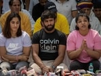 Indian wrestlers Vinesh Phogat, Bajrang Punia, and Sakshi Malik
