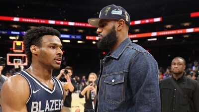 (Bronny James, #0, is greeted by his father and NBA player LeBron James (AFP) (Bronny James, #0, is greeted by his father and NBA player LeBron James (AFP)