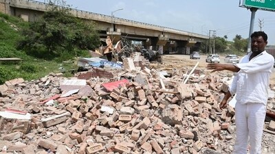 A man shows the demolished shops in Nuh district. (HT File) A man shows the demolished shops in Nuh district. (HT File)