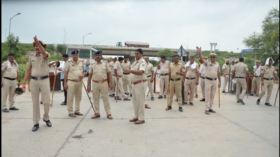 Heavy police deployed on the Gurugram-Nuh border near the KMP expressway after violence occurred between two groups in the Nuh district of Haryana on Thursday. (ANI)