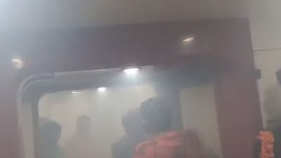 A man smokes a cigarette in the train toilet and the train is full of smoke. (Twitter/ @TeluguScribe) A man smokes a cigarette in the train toilet and the train is full of smoke. (Twitter/ @TeluguScribe)