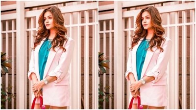 In white sneakers and a pink and white sling bag, Rubina further accessorised her look for the day. (Instagram/@rubinadilaik) In white sneakers and a pink and white sling bag, Rubina further accessorised her look for the day. (Instagram/@rubinadilaik)