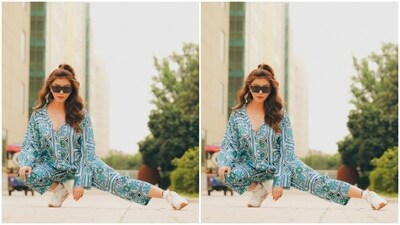 Rubina decked up in a floral cotton co-ord set featuring a shirt and a pair of matching cotton trousers. The co-ord set came with floral patterns in shades of blue and green on white. (Instagram/@rubinadilaik) Rubina decked up in a floral cotton co-ord set featuring a shirt and a pair of matching cotton trousers. The co-ord set came with floral patterns in shades of blue and green on white. (Instagram/@rubinadilaik)