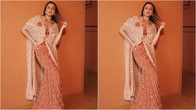 Playing muse to fashion designer Arpita Mehta, she picked up an orange co-ord set consisting of a halterneck bralette, fishtail maxi skirt and cape. The butti print that is adorned all over her outfit is just stunning. (Instagram/@aslisona) Playing muse to fashion designer Arpita Mehta, she picked up an orange co-ord set consisting of a halterneck bralette, fishtail maxi skirt and cape. The butti print that is adorned all over her outfit is just stunning. (Instagram/@aslisona)