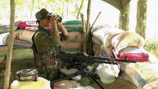 An Assam Rifles officer keeps a watch in Manipur’s Phaileng village amid ethnic clashes in Manipur (PTI)