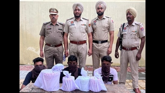The Amritsar rural police have busted a cross-border drug smuggling racket by arresting three persons and recovering 12 kg of heroin from their possession. (HT Photo)