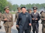 North Korean leader Kim Jong Un walks with officials during an inspection of the Korean People's Army (KPA) Air and Anti-Air Force Unit 44.