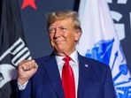 FILE PHOTO: Former U.S. President and Republican presidential candidate Donald Trump greets the crowd during a campaign rally in Windham, New Hampshire, U.S., August 8, 2023.