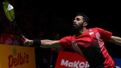 India's Prannoy HS hits a return against Denmark's Viktor Axelsen during their men's singles semifinal at the Indonesia Open Badminton tournament in Jakarta (AFP)