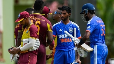 Tilak Varma (2R) and Hardik Pandya (R), of India, after winning the third T20I against West Indies (AFP) Tilak Varma (2R) and Hardik Pandya (R), of India, after winning the third T20I against West Indies (AFP)