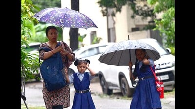 Children headed to school amid the rain in Chandigarh on Friday. (Keshav Singh/HT) Children headed to school amid the rain in Chandigarh on Friday. (Keshav Singh/HT)