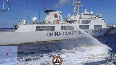In this handout photo, a Chinese coast guard ship uses water canons on a Philippine Coast Guard ship near the Philippine-occupied Second Thomas Shoal, South China Sea as they blocked its path during a re-supply mission on Aug 5 (AP) In this handout photo, a Chinese coast guard ship uses water canons on a Philippine Coast Guard ship near the Philippine-occupied Second Thomas Shoal, South China Sea as they blocked its path during a re-supply mission on Aug 5 (AP)