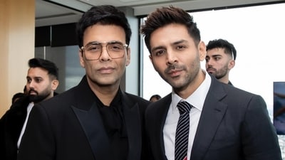Both Karan Johar and Kartik Aaryan were decked up in black suits for the inauguration of the Indian Film Festival of Melbourne. While Kartik paired it with a white shirt and a striped black tie, Karan wore a black shirt with the suit. Both Karan Johar and Kartik Aaryan were decked up in black suits for the inauguration of the Indian Film Festival of Melbourne. While Kartik paired it with a white shirt and a striped black tie, Karan wore a black shirt with the suit. 
