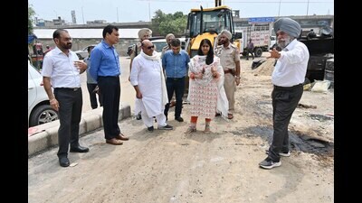 LMLA Gurpreet Bassi Gogi and MC commissioner Shena Aggarwal inspect the ongoing work of Pakhowal road railway under bridge and railway over bridge in Ludhiana on Friday. (HT Photo)