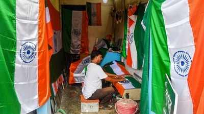 A worker prepares Indian flags ahead of Independence Day celebrations, in Dharmanagar. (PTI) A worker prepares Indian flags ahead of Independence Day celebrations, in Dharmanagar. (PTI)