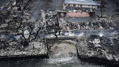 TOPSHOT - An aerial image taken on August 10, 2023 shows destroyed homes and buildings on the waterfront burned to the ground in Lahaina in the aftermath of wildfires in western Maui, Hawaii. At least 36 people have died after a fast-moving wildfire turned Lahaina to ashes, officials said August 9, 2023 as visitors asked to leave the island of Maui found themselves stranded at the airport. The fires began burning early August 8, scorching thousands of acres and putting homes, businesses and 35,000 lives at risk on Maui, the Hawaii Emergency Management Agency said in a statement. (AFP)