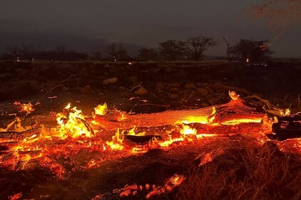 A wildfire burns in Kihei, Hawaii late Wednesday, Aug. 9, 2023. Thousands of residents raced to escape homes on Maui as blazes swept across the island, destroying parts of a centuries-old town in one of the deadliest U.S. wildfires in recent years. (AP Photo/Ty O'Neil) (AP) A wildfire burns in Kihei, Hawaii late Wednesday, Aug. 9, 2023. Thousands of residents raced to escape homes on Maui as blazes swept across the island, destroying parts of a centuries-old town in one of the deadliest U.S. wildfires in recent years. (AP Photo/Ty O'Neil) (AP)