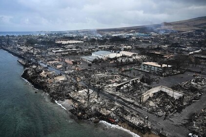 An aerial image taken on August 10, 2023 shows destroyed homes and buildings on the waterfront burned to the ground in Lahaina in the aftermath of wildfires in western Maui, Hawaii. At least 36 people have died after a fast-moving wildfire turned Lahaina to ashes, officials said August 9, 2023 as visitors asked to leave the island of Maui found themselves stranded at the airport. The fires began burning early August 8, scorching thousands of acres and putting homes, businesses and 35,000 lives at risk on Maui, the Hawaii Emergency Management Agency said in a statement. (Photo by Patrick T. Fallon / AFP) (AFP) An aerial image taken on August 10, 2023 shows destroyed homes and buildings on the waterfront burned to the ground in Lahaina in the aftermath of wildfires in western Maui, Hawaii. At least 36 people have died after a fast-moving wildfire turned Lahaina to ashes, officials said August 9, 2023 as visitors asked to leave the island of Maui found themselves stranded at the airport. The fires began burning early August 8, scorching thousands of acres and putting homes, businesses and 35,000 lives at risk on Maui, the Hawaii Emergency Management Agency said in a statement. (Photo by Patrick T. Fallon / AFP) (AFP)