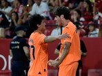 Valencia's Spanish midfielder #8 Javi Guerra celebrates scoring his team's second goal with Valencia's Spanish midfielder #27 Pablo Gozalbez (L) Valencia's Spanish midfielder #8 Javi Guerra celebrates scoring his team's second goal with Valencia's Spanish midfielder #27 Pablo Gozalbez (L)