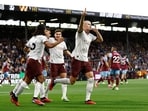 Manchester City's Erling Braut Haaland celebrates scoring their first goal with teammates 