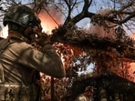 Ukrainian servicemen fire a howitzer towards Russian troops at a position near the frontline town of Bakhmut, amid Russia’s attack, in Donetsk region, Ukraine. (REUTERS)