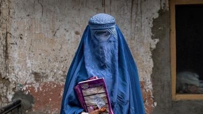Arefeh 40-year-old, an Afghan woman leaves an underground school, in Kabul, Afghanistan. (AP) Arefeh 40-year-old, an Afghan woman leaves an underground school, in Kabul, Afghanistan. (AP)