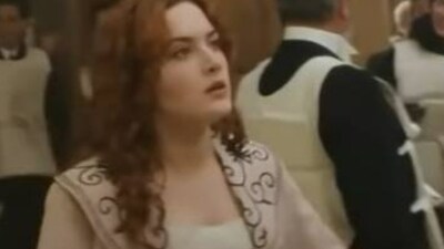 Screenshot of Kate Winslet wearing the overcoat in a scene from 'Titanic' (YouTube)