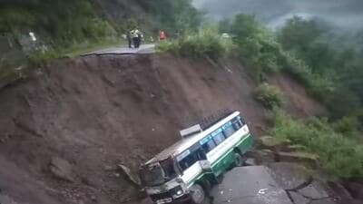 The bus which fell off the road inSundernagar subdivision of Mandi following a cave-in on the Mandi-Shimla highway. (HT Photo)