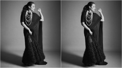 Her stunning black saree features shimmering fabric and fur detailing at the bottom. She drapes it gracefully, with the pallu falling from her shoulder. She pairs it with a matching blouse with half sleeves. (Instagram/@amratasoni) Her stunning black saree features shimmering fabric and fur detailing at the bottom. She drapes it gracefully, with the pallu falling from her shoulder. She pairs it with a matching blouse with half sleeves. (Instagram/@amratasoni)