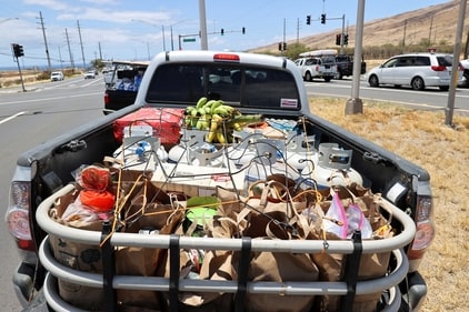 A truck carrying supplies for people affected by the West Maui wildfires is stuck in heavy traffic after officials allowed residents and tourists back into the area, in Maalaea, Maui, Hawaii, U.S. August 11, 2023. REUTERS/Marco Garcia (REUTERS)