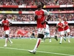 Arsenal's English midfielder #07 Bukayo Saka celebrates scoring the team's second goal during the Premier League match against Nottingham Forest